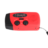 Rode noodradio met draaiknoppen voor volume en tuner, geschikt voor noodgevallen.